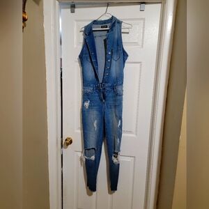 Bebe Distressed ripped jumpsuit